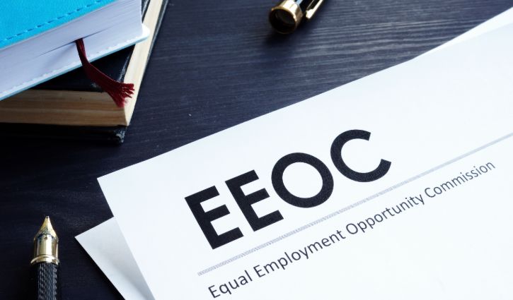 Equal Employment Opportunity Commission EEOC document and pen on a table.