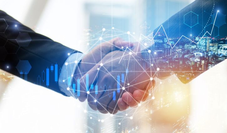 Two people in suits shaking hands, overlayed with a futuristic digital network and financial graphs, symbolize a business agreement with Glyde or partnership in a technology-driven environment. Cityscape and bar graphs add depth to this visionary collaboration.