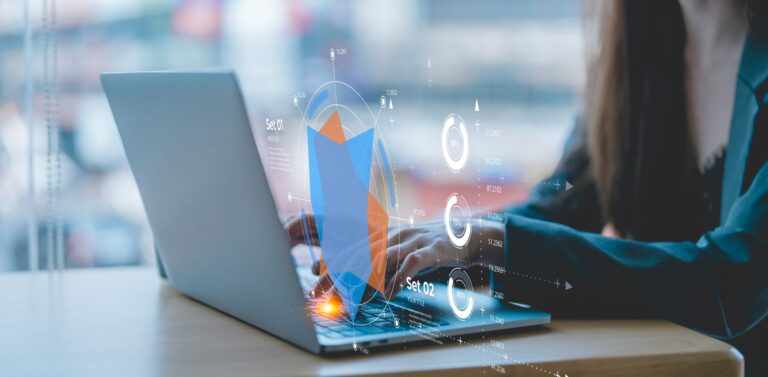 A person using a laptop at a desk, with holographic graphs and data analytics charts displaying an optimized sales compensation strategy above the keyboard. The background is a blurred modern office setting, suggesting a pathway to success.