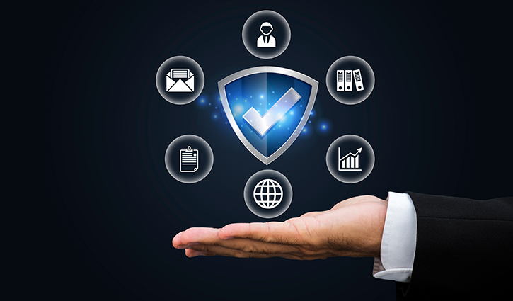 A hand in a suit holds out a digital shield with a checkmark, surrounded by seven security-related icons—symbolizing protection, cybersecurity, and the industry expertise behind innovative insurance solutions.
