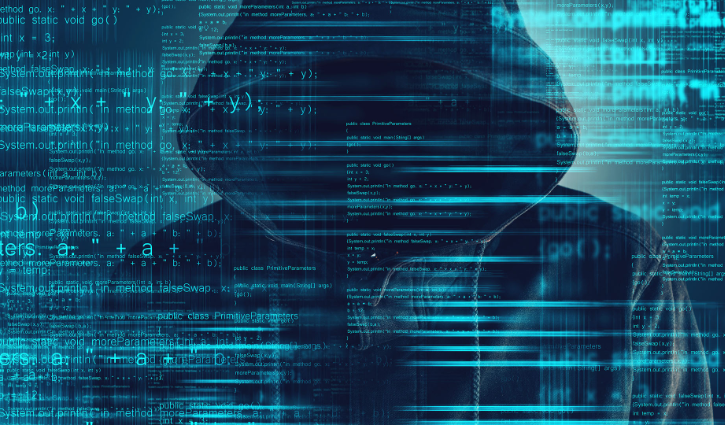 A mysterious figure in a hoodie, face obscured, is surrounded by glowing computer code and digital graphics in shades of blue, capturing a cybersecurity solutions theme.