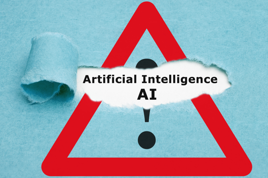 A red warning triangle with an exclamation mark rests on a blue background. The center is torn open to reveal the text “Artificial Intelligence AI” in bold black letters on a white strip, reminiscent of ChatGPTs transformative role in modern communication and recruitment.