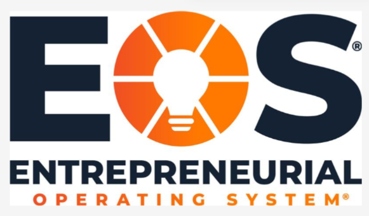 Logo of EOS Entrepreneurial Operating System featuring EOS in bold letters. The O has a lightbulb with orange rays, symbolizing bright business ideas. Below, ENTREPRENEURIAL OPERATING SYSTEM is seamlessly written, capturing the essence of running an efficient business.