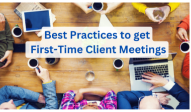 Best Practices to get First-Time Client Meetings 8 A group of people sit around a wooden table with coffee cups, a laptop, and a tablet. The text overlay reads Best Practices for First-Time Client Meetings, highlighting the focus on effective strategies in business teamwork.